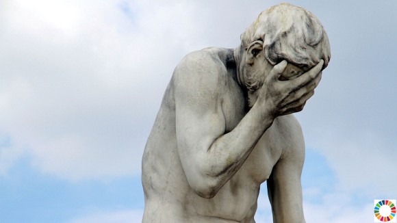 A statue in Paris, holding its head in shame.