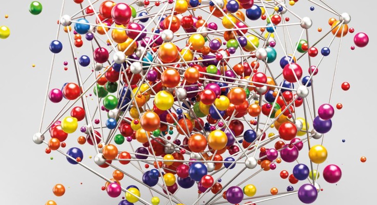 A metallic structure containing colorful ball structures.