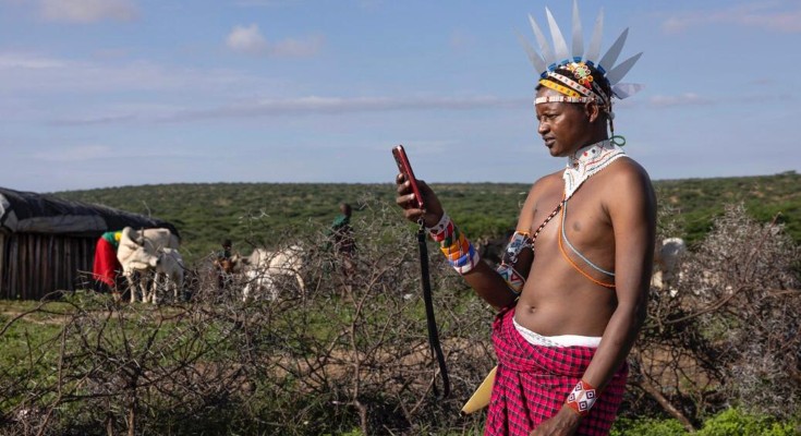 TA user in Samburu checking the app before leaving for the grazing fields.