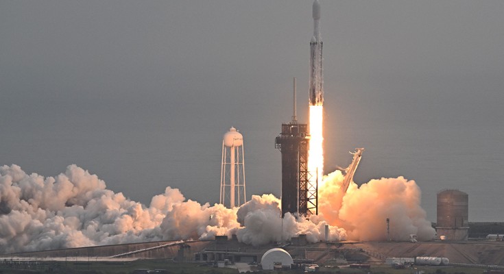 A rocket blasts off from a launch pad