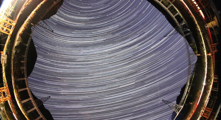 A view of white rings in the sky viewed from the ground