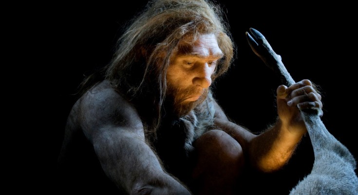 An artist's impression of a Neanderthal working on an animal with hooves