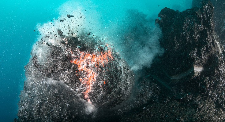 Pillow lava forming from an undersea fissure in Hawaii.