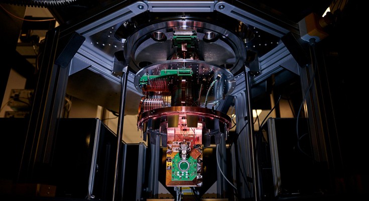 A quantum computer chip in a display case. The chip is from Oxford Ionics