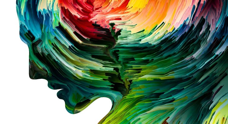  silhouette of face painted with swirling colours