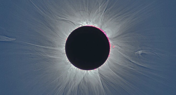 A solar eclipse, with the Sun's corona visible.