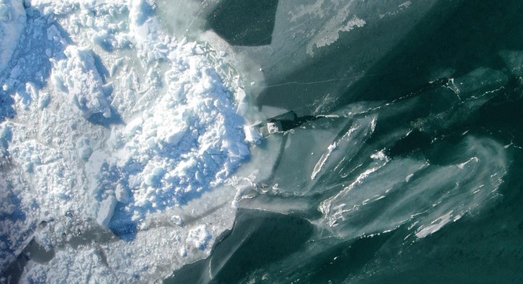 Aerial view of densely packed fjord ice in front of the glacier Eqalorutsit Kangilliit Sermiat, South Greenland