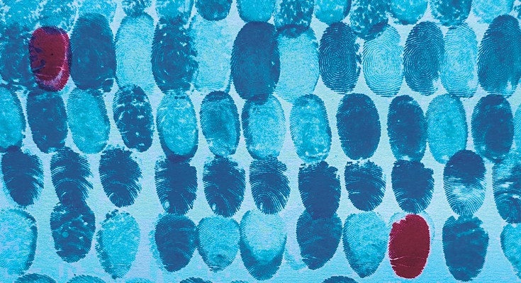 A pattern of blue fingerprints, with some isolated red ones